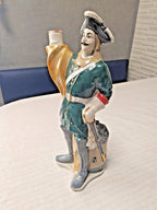 Vintage USSR decanter figure holding a banner with drum at the back