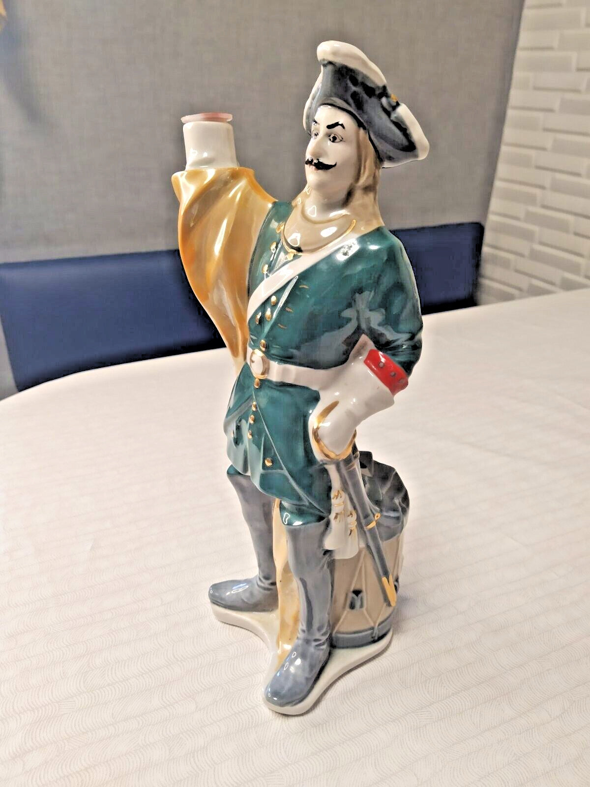 Vintage USSR decanter figure holding a banner with drum at the back