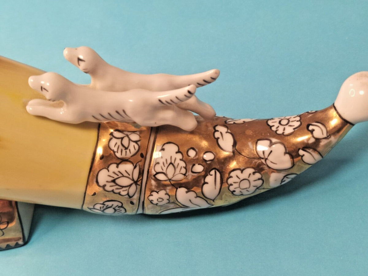 Leaping deer figure at the rim of the Krasnodar Chaika porcelain horn