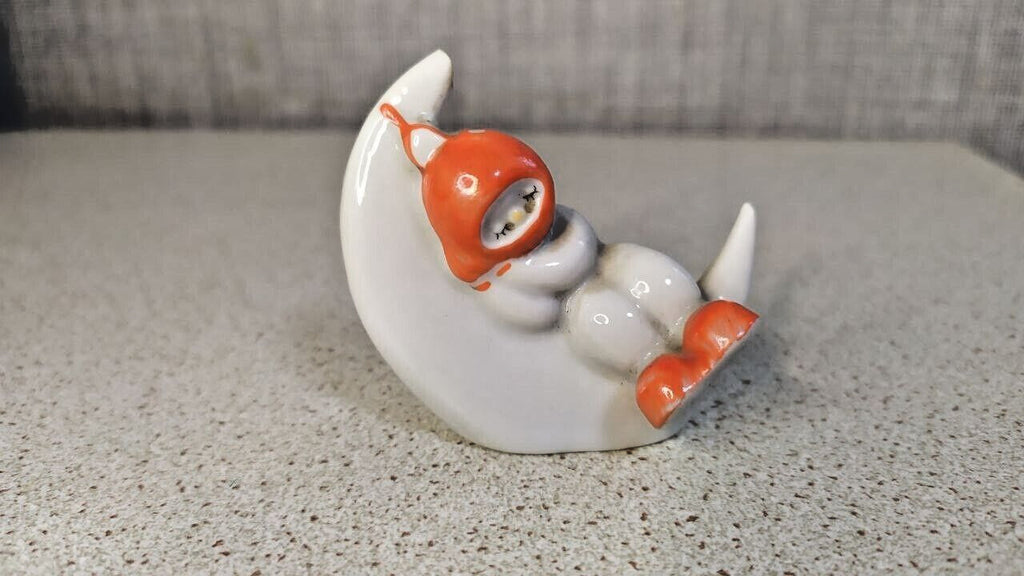 Soviet porcelain figurine of a sleeping child on a crescent moon from Polonne