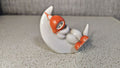 Soviet porcelain figurine of a sleeping child on a crescent moon from Polonne