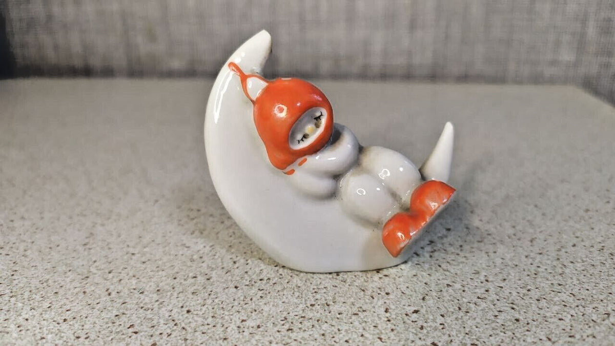 Soviet porcelain figurine of a sleeping child on a crescent moon from Polonne