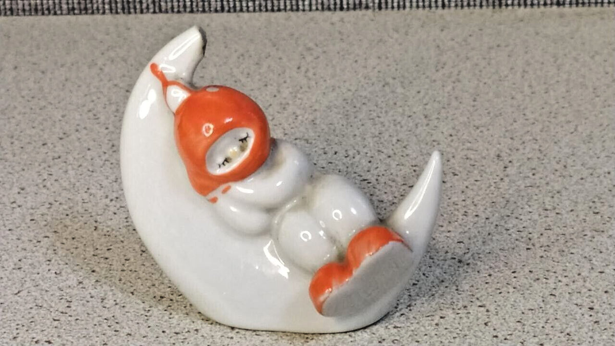 Vintage USSR porcelain figurine with orange-red hood and booties