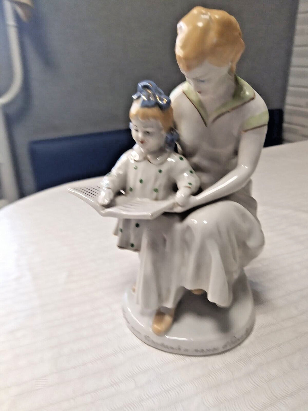 Soviet porcelain figurine of a mother and daughter reading a book together