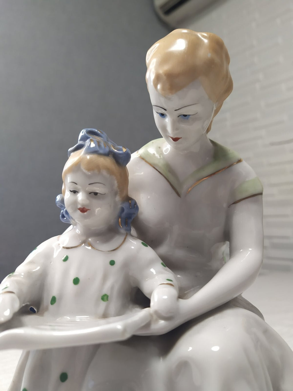 Mother and child reading porcelain figure, front view