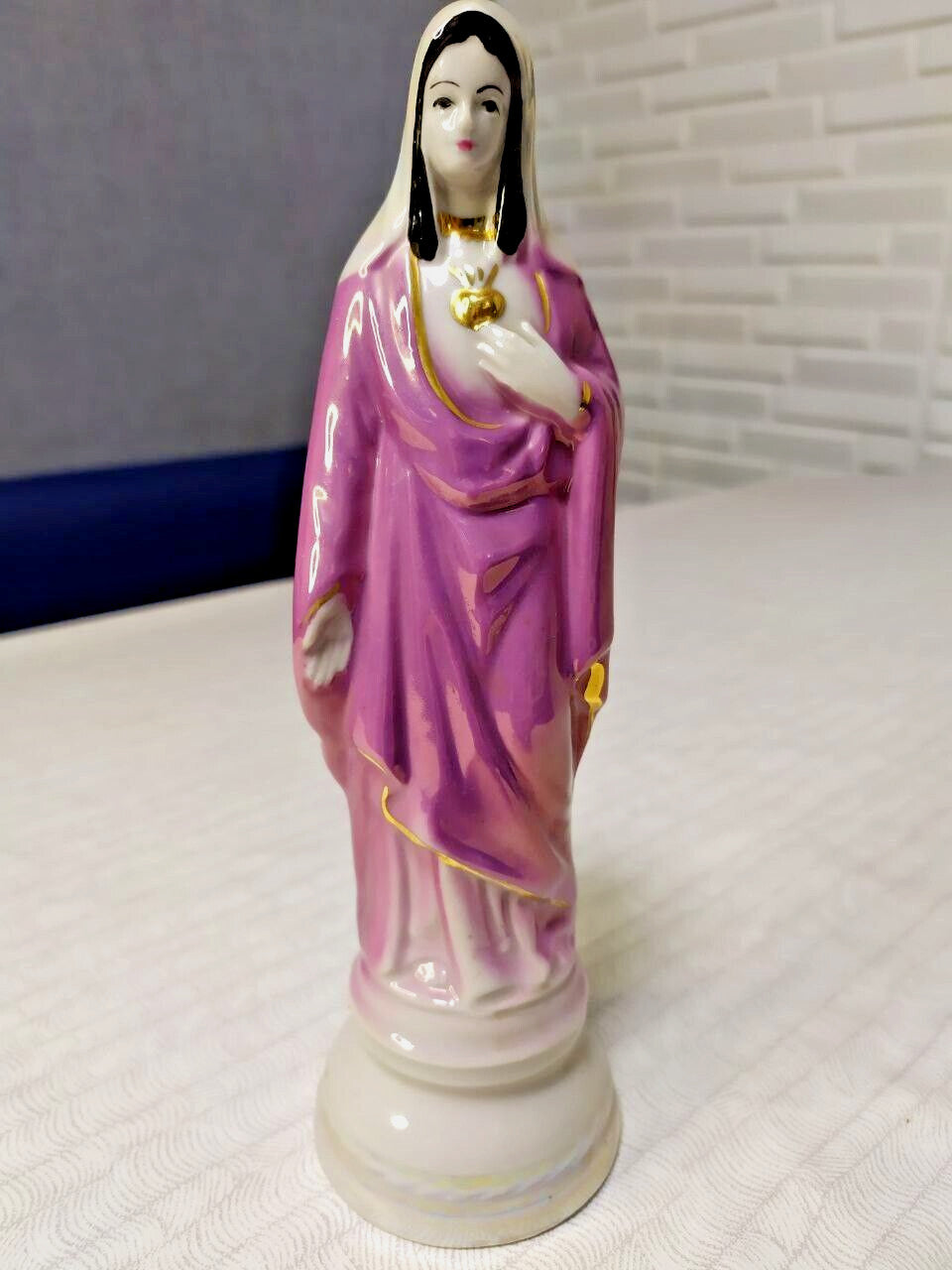 Virgin Mary figurine in purple-pink robe with hand-painted gold trim