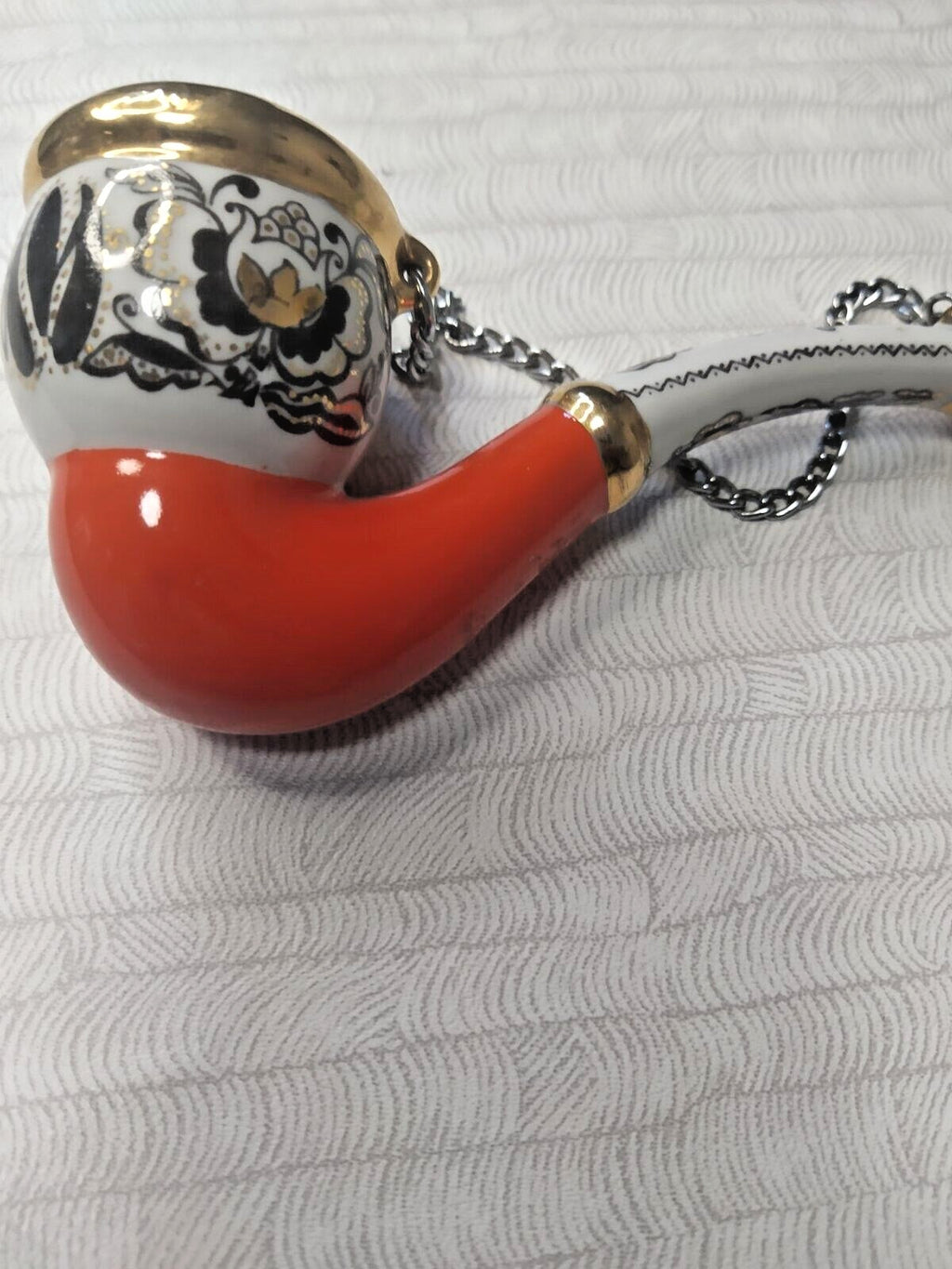Decorative porcelain pipe with red and black flowers and hanging chain – detail 5