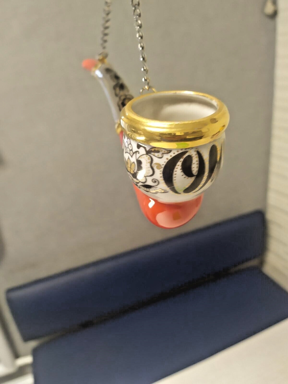 Decorative porcelain pipe with red and black flowers and hanging chain – detail 8