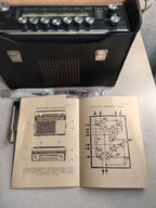Soviet portable radio Mayak-M in black with analog dial and Cyrillic lettering