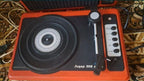 Lider-306 Mono electrophone with lid open showing turntable and tonearm