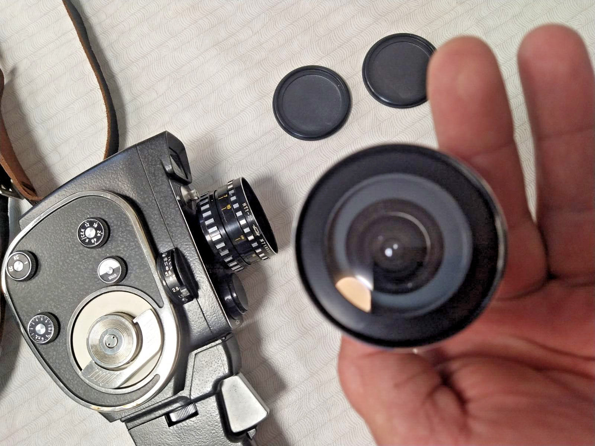 Soviet Quarz-2x8S-1M 8mm movie camera with Meteor-8M zoom lens and pistol grip