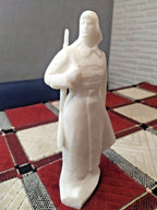 Soviet Red Army soldier figurine in budenovka cap and overcoat with rifle