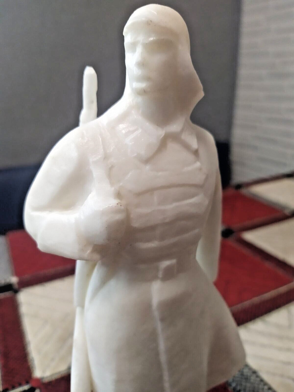Vintage Soviet soldier statuette with rifle slung over the back