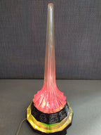 Vintage soviet lamp glowing warm yellow like a rocket exhaust trail