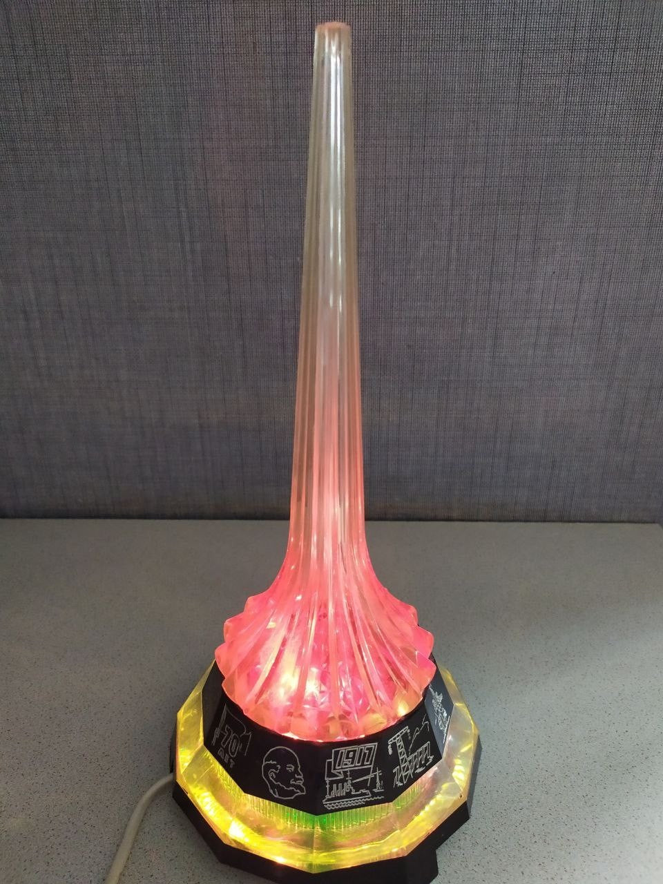 Vintage soviet lamp glowing warm yellow like a rocket exhaust trail