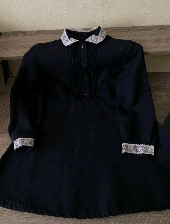Hand-sewn cuffs on the USSR school uniform dress