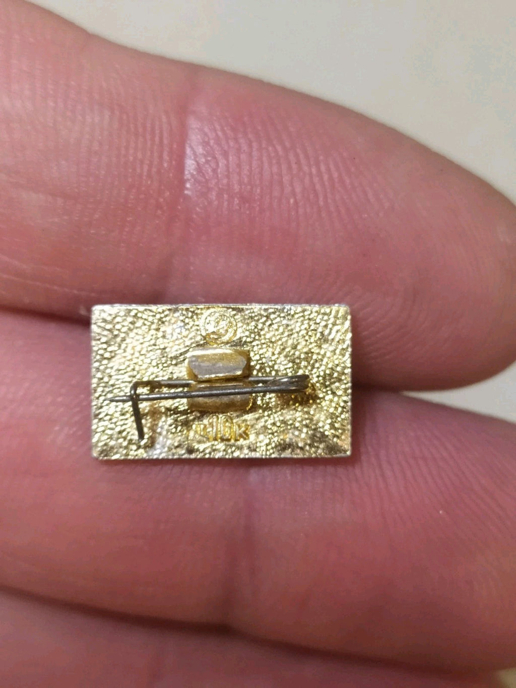 Old Soviet aluminum badge reverse side