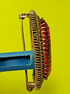 Gilded USSR brooch shown with measuring tape for scale – detail 13
