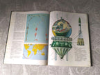 Soviet space memorabilia book page with rocket and orbital station diagrams