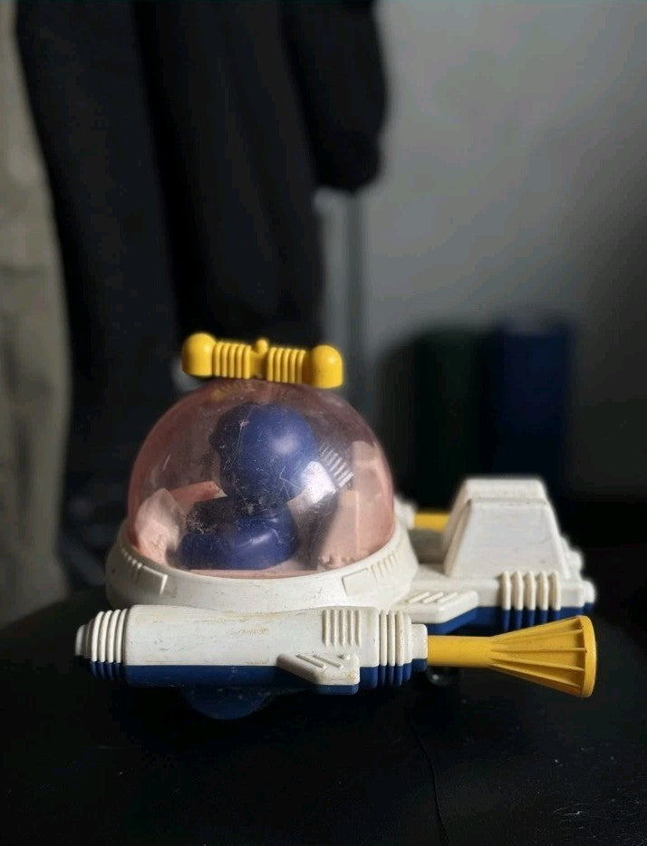 Vintage Soviet toy rocket in blue and white with yellow booster nozzles