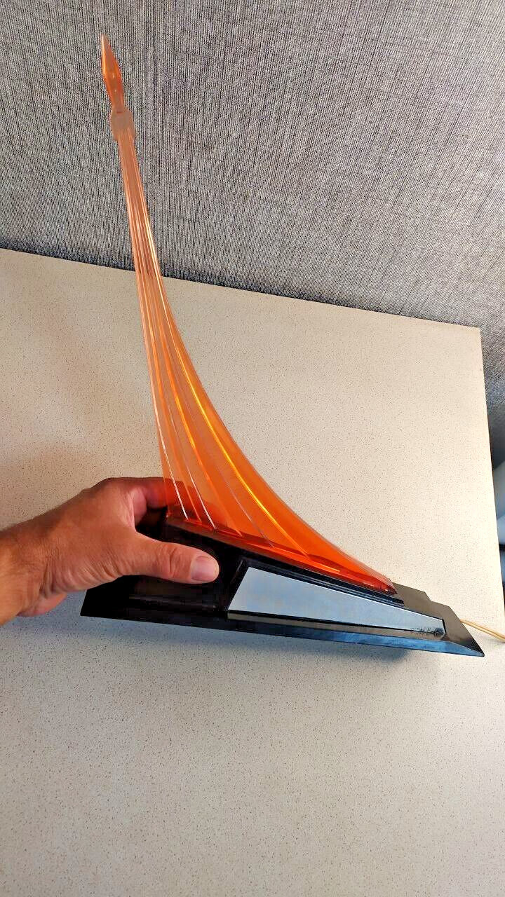 Vintage Soviet rocket lamp lit with translucent orange-red plexiglass
