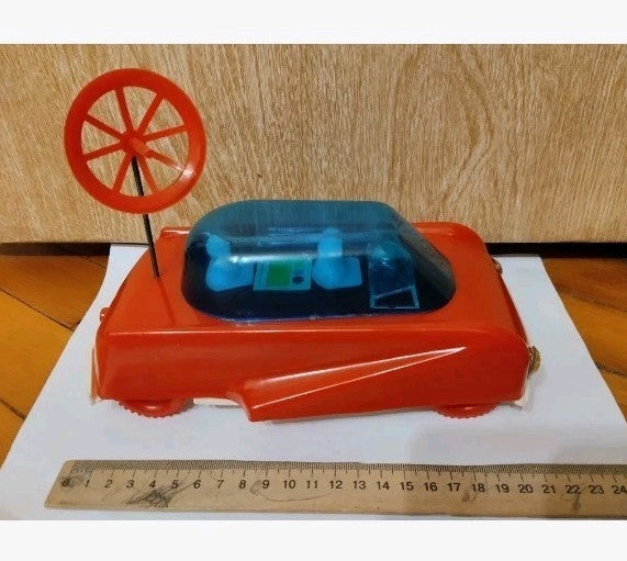Soviet space toy Planetohod rover with red body, blue canopy and radar dish