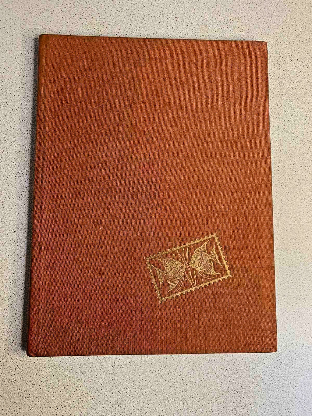 Vintage Soviet stamp collection album with orange cover and hundreds of stamps