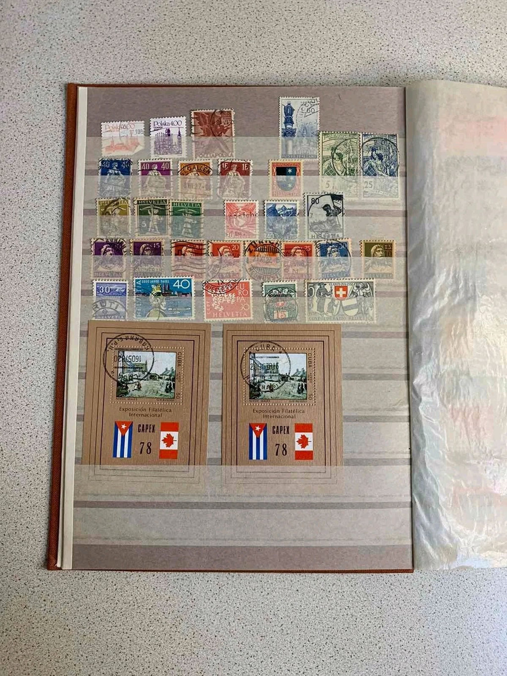 Soviet space stamps and Apollo-Soyuz souvenir sheets in the album – detail 11