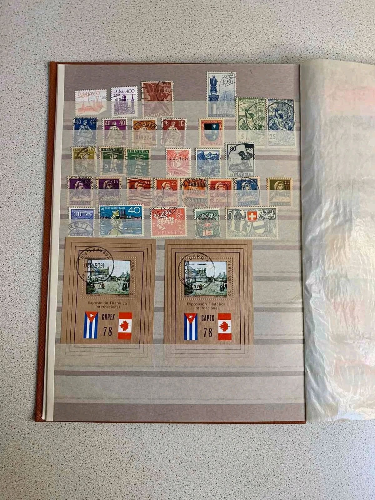 Soviet space stamps and Apollo-Soyuz souvenir sheets in the album – detail 11