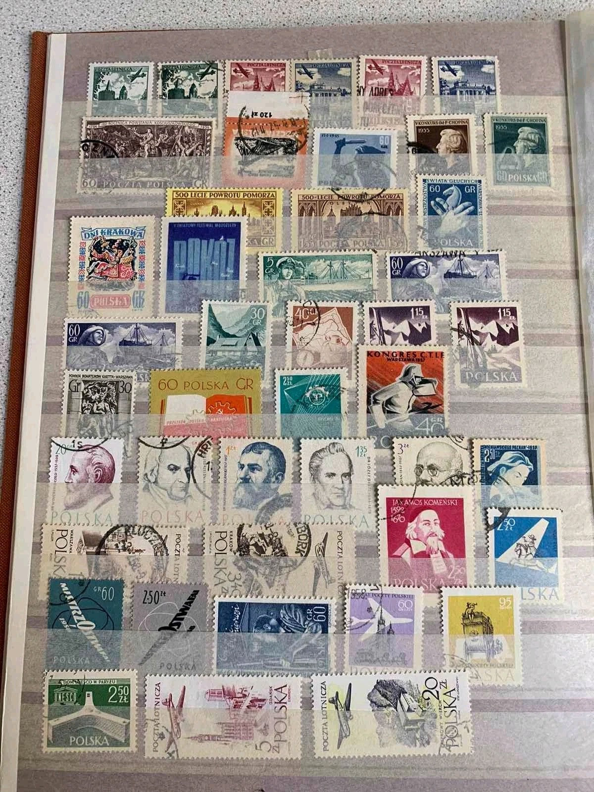 Eastern Bloc stamps arranged behind protective strips on album pages – detail 7