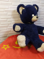 Large USSR teddy bear showing cream paws and black collar with metal buckle