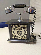 Soviet era telephone front panel with 1500 Kyiv emblem and floral pattern