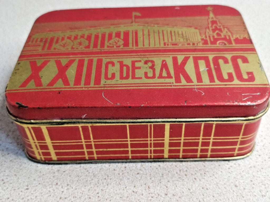 Side of the Soviet memorabilia tin with checkered tartan-style pattern