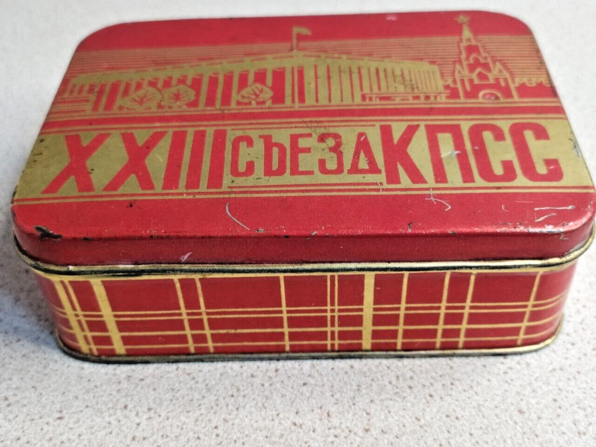 Side of the Soviet memorabilia tin with checkered tartan-style pattern