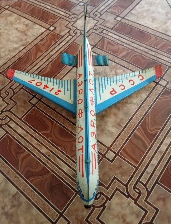 Soviet tin toy airplane Tu-104 in Aeroflot livery with tail number CCCP-21407