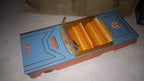 Lithographed dashboard and seat patterns inside the Raduga tin toy car