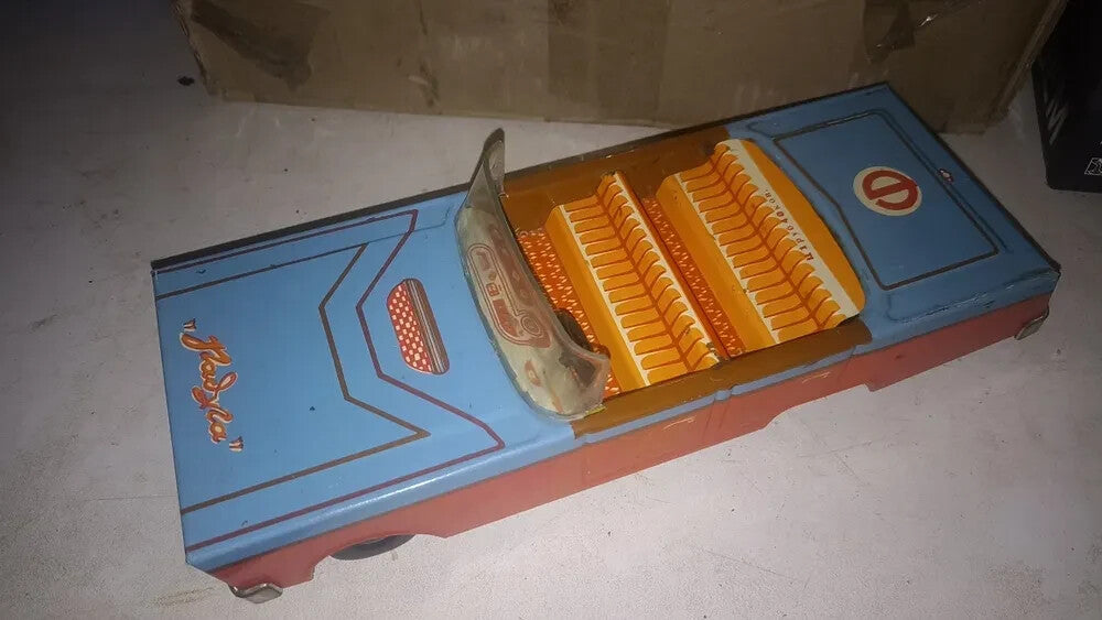 Lithographed dashboard and seat patterns inside the Raduga tin toy car