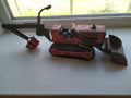 Soviet tin toy excavator bulldozer in red and black with plastic tracks