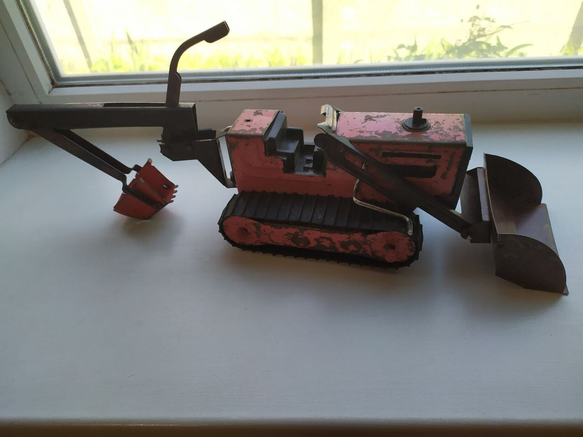 Soviet tin toy excavator bulldozer in red and black with plastic tracks