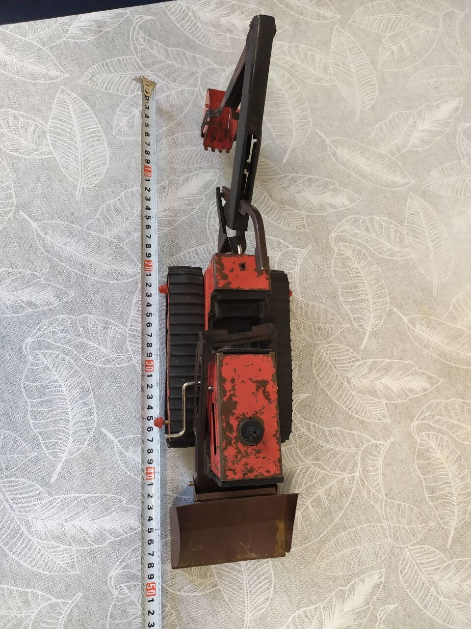 Detached front bulldozer blade of the old Soviet toy with its mounting frame – detail 10
