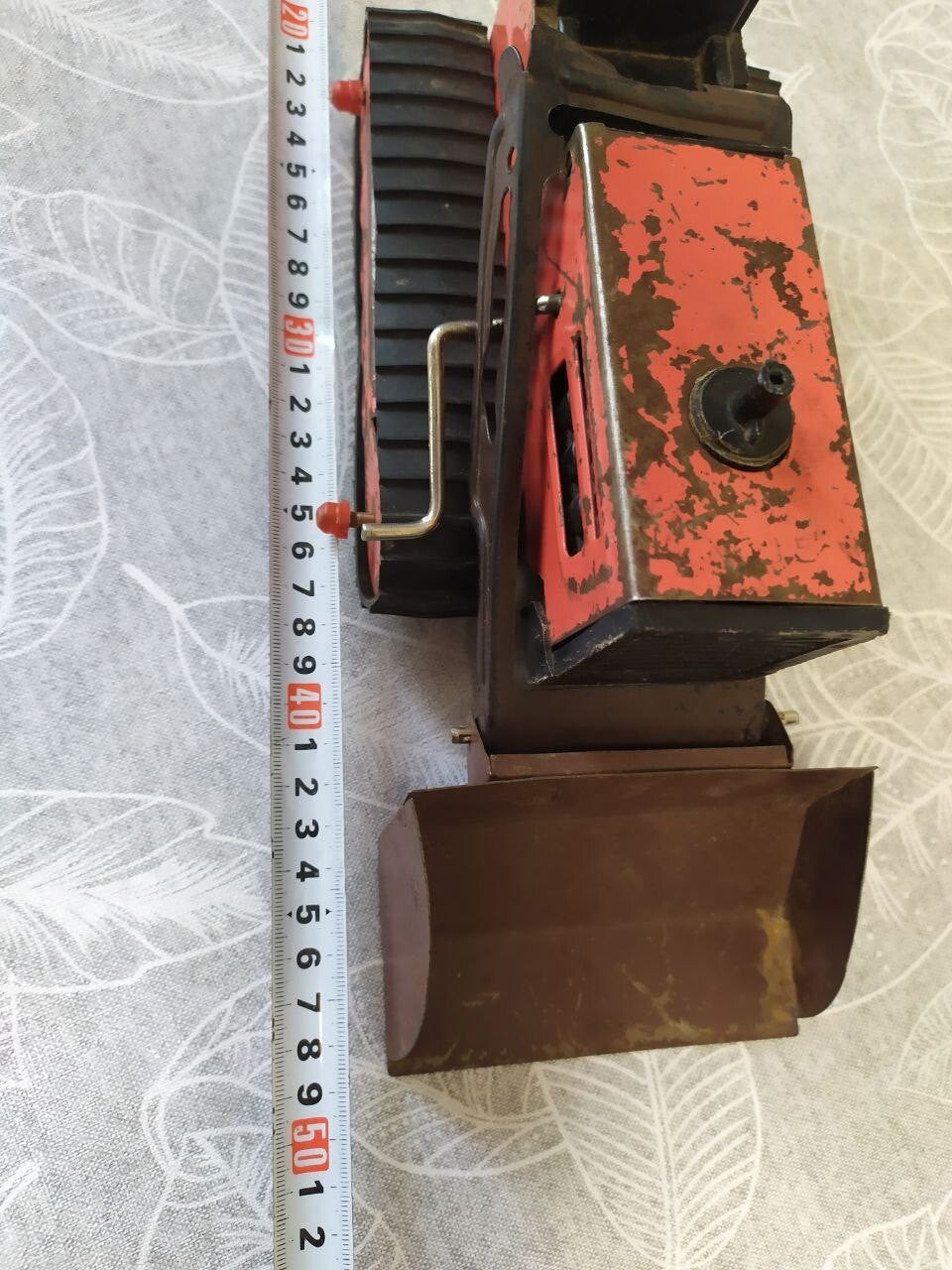 Detached front bulldozer blade of the old Soviet toy with its mounting frame – detail 16