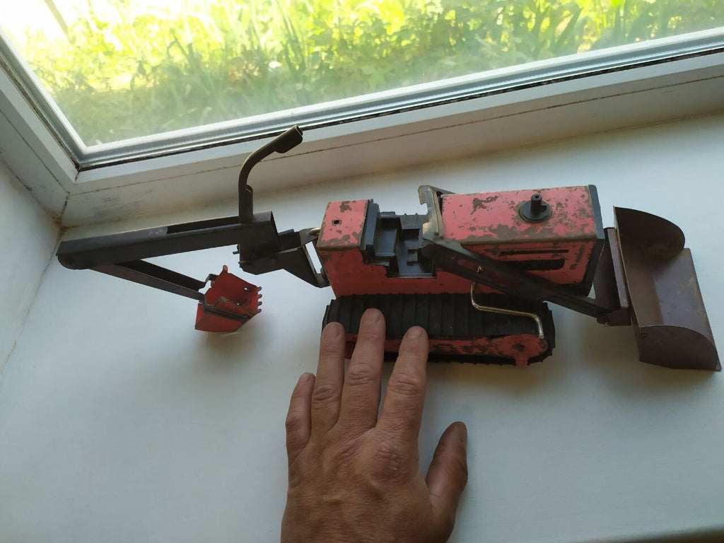Bottom of the Soviet tin toy with factory emblem and price 4 rubles 50 kopecks