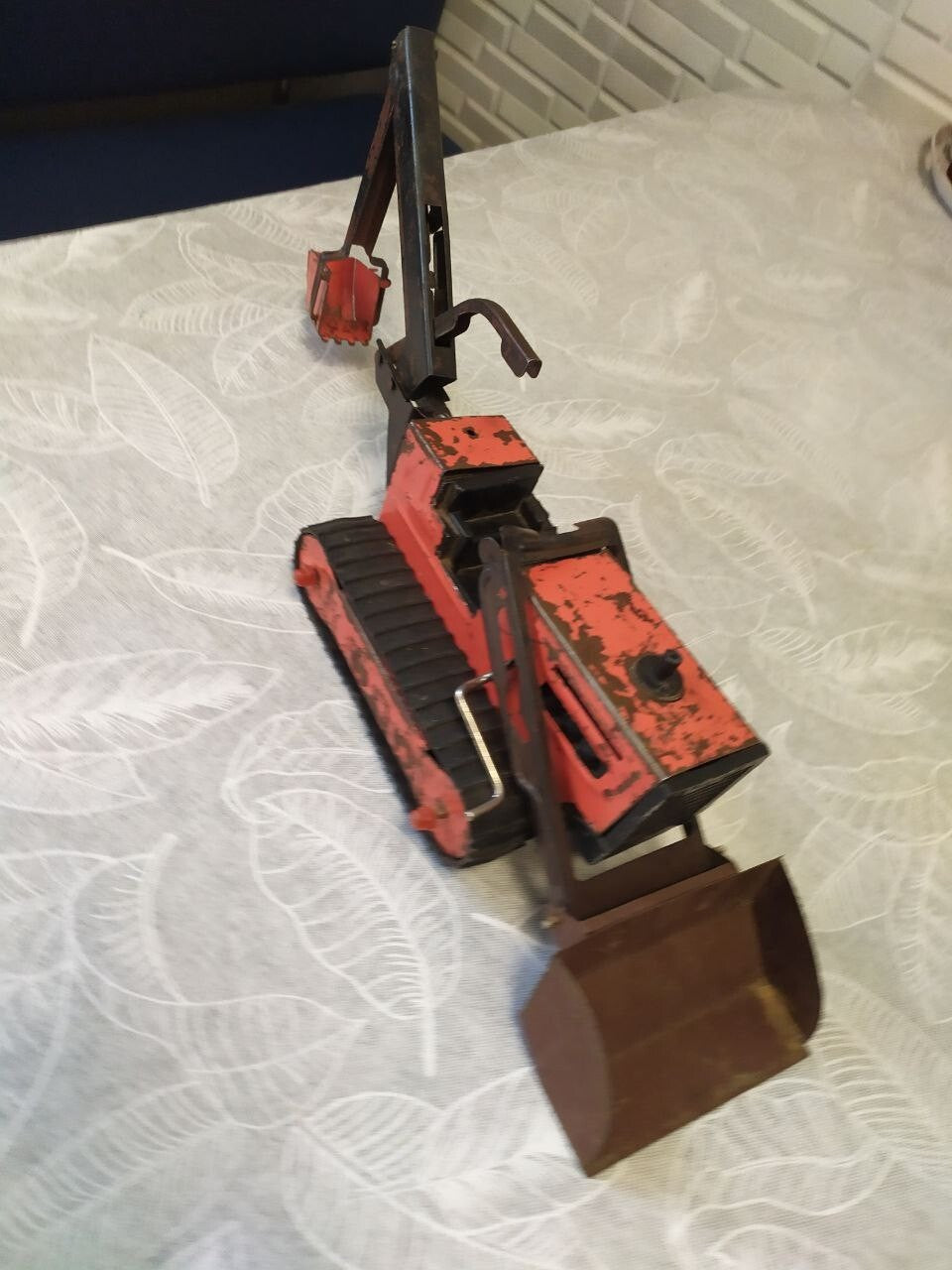 Detached front bulldozer blade of the old Soviet toy with its mounting frame