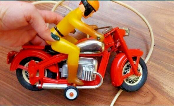 Orange wired remote control unit for Soviet tin toy motorcycle