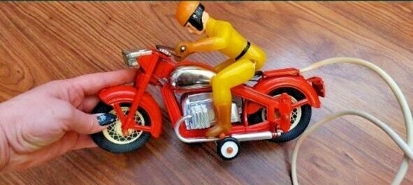 Old Soviet toy motorcycle red lithographed tin body, side view