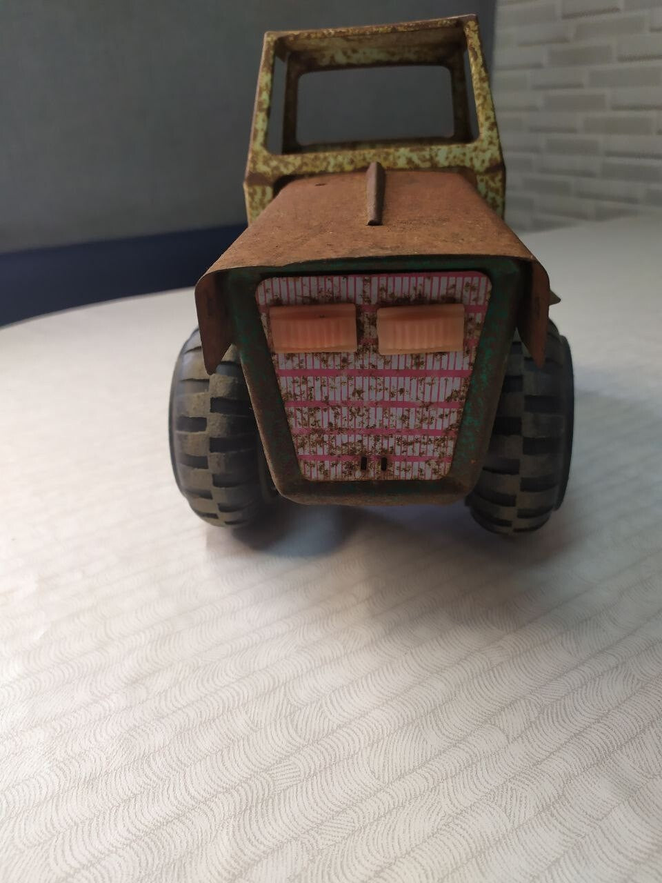 Soviet toy tractor shown with measuring tape for scale – detail 10