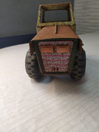 Soviet toy tractor shown with measuring tape for scale – detail 10