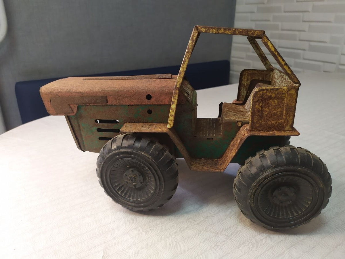 Soviet toy tractor shown with measuring tape for scale – detail 13