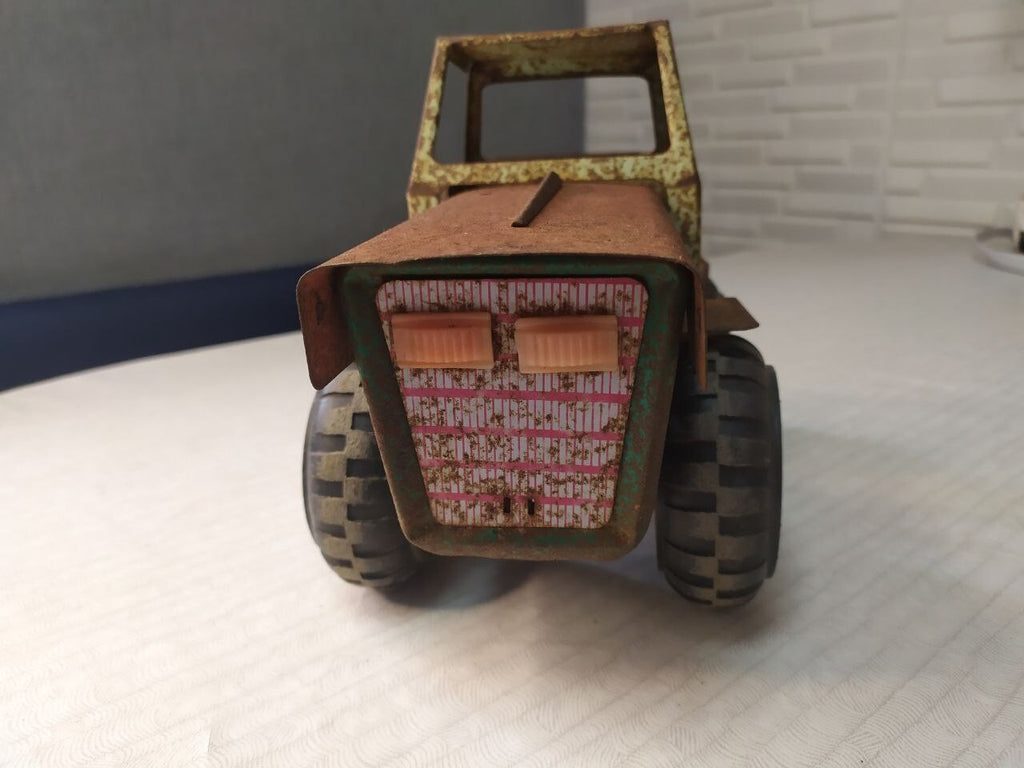 Soviet toy tractor shown with measuring tape for scale – detail 16
