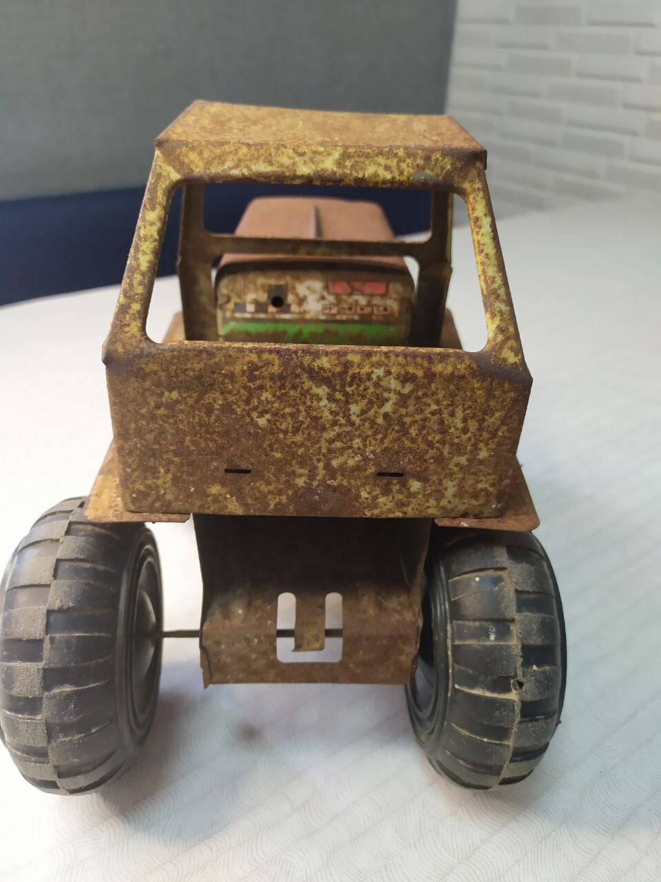 Old Soviet tin toy tractor side view with large rubber tires – detail 9